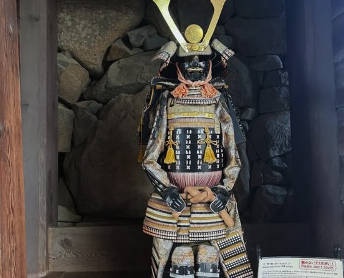 Samurai armour and weapon displays inside Matsumoto Castle museum