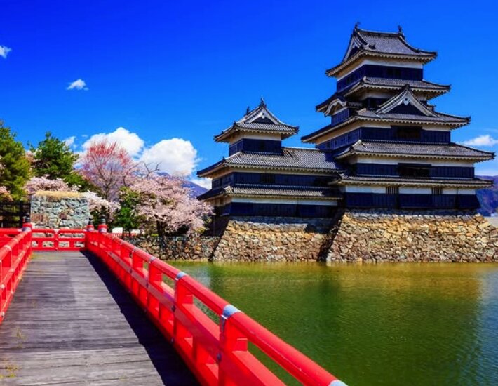 Matsumoto Castle viewed from the red bridge over the moat